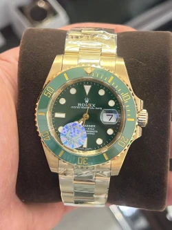 Rolex Submariner Date in Yellow Gold with Green Dial and Bezel